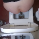 A ceiling mounted camera records a woman shitting while sitting on a toilet in voyeuristic style. Poop action is clearly seen from the rear. She wipes her ass and shows off her dirty TP. Presented in 720P HD. About 7 minutes.